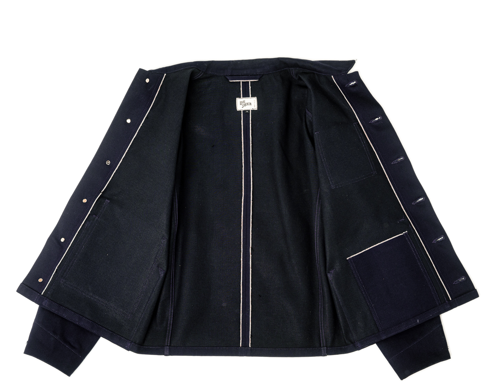 Black jacket with white piping on a white background