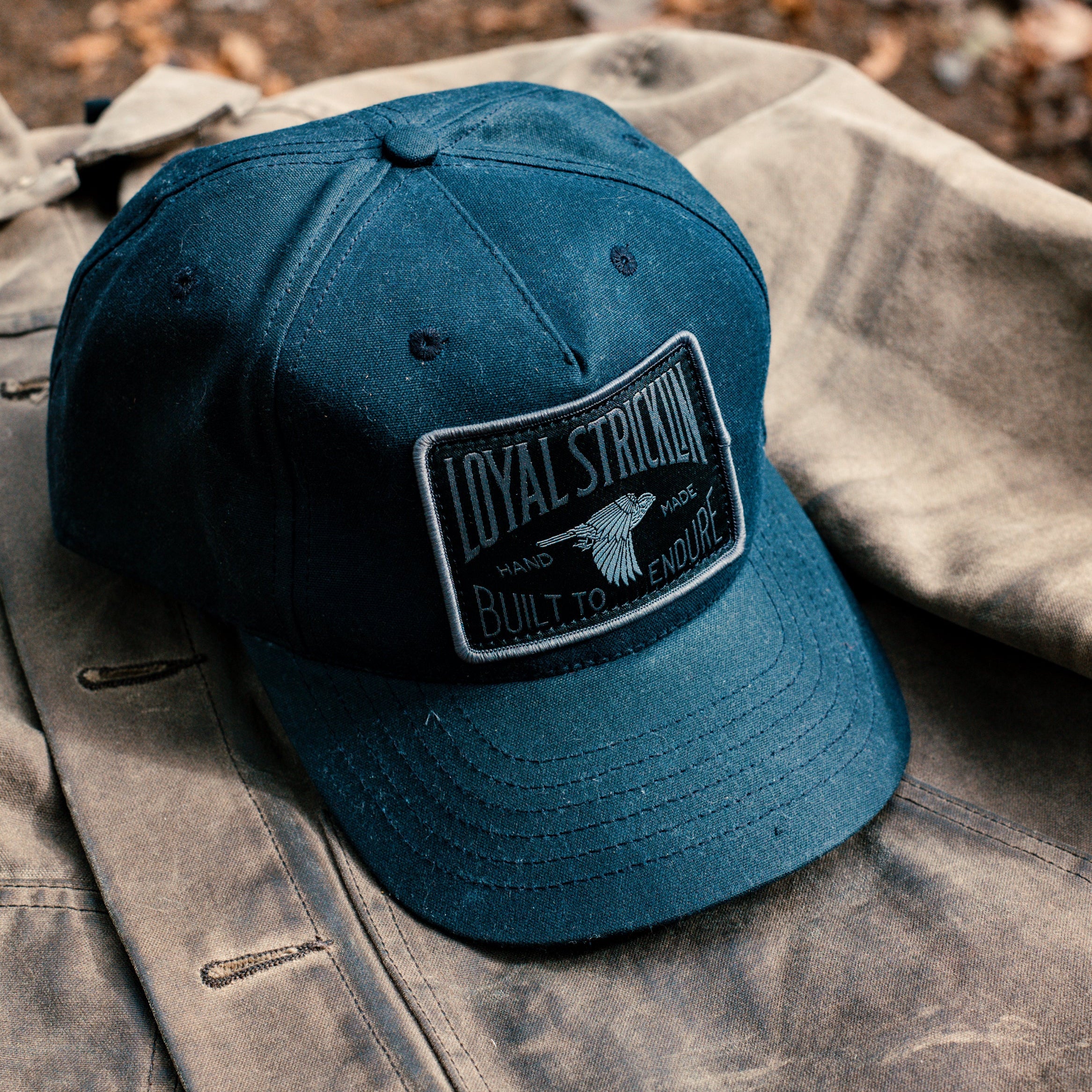 Blue cap with a patch on a textured surface