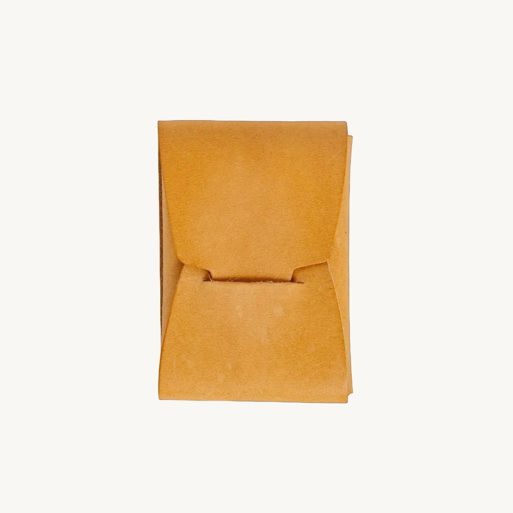 Orange leather wallet on a light gray background